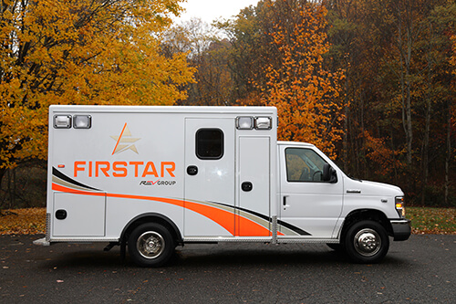 Image of Firstar ambulance in front of trees in the fall