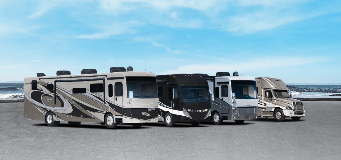 Image of RV's lined up by the ocean - American Coach, Fleetwood, Holiday Rambler and Renegade