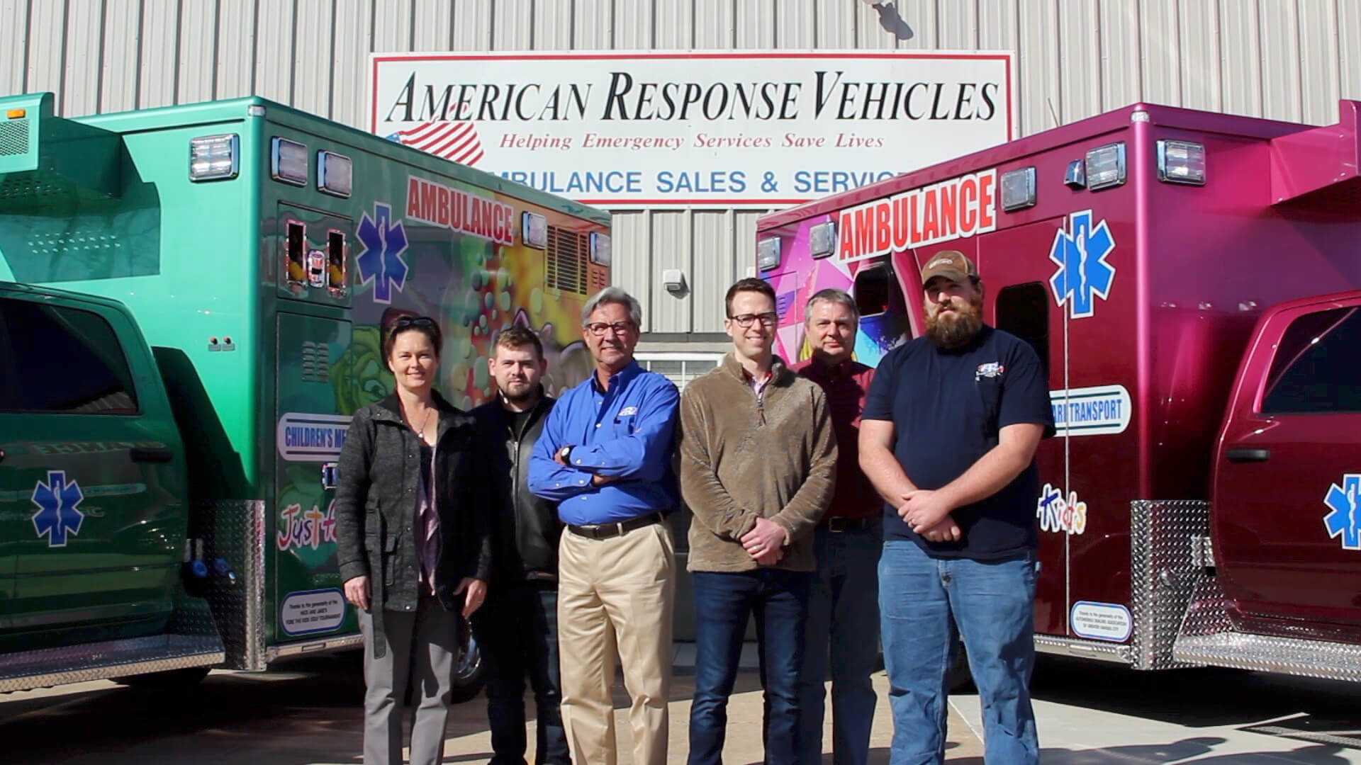 Image of people standing in front of two ambulances for American Response Vehicles for Indiana.