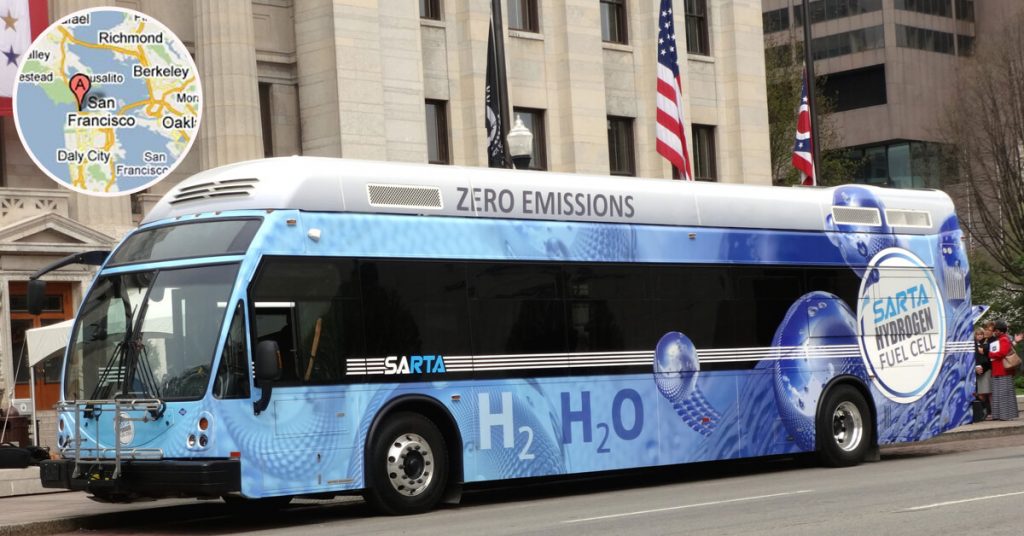 Image of the ENC Zero Emissions Bus in front of buildings on a street