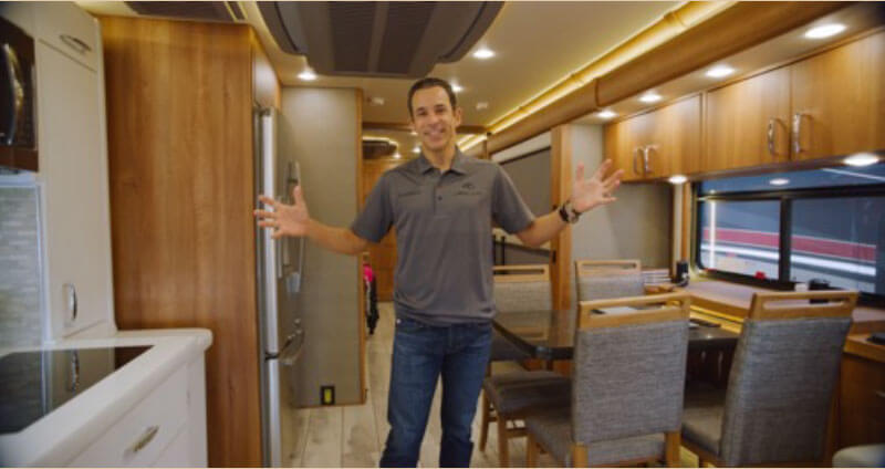 Helio Castroneves inside an American Coach RV