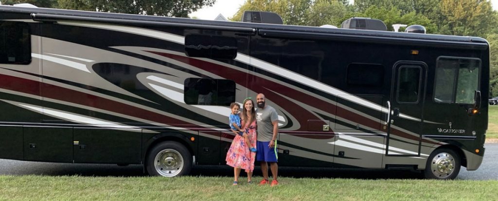 An image of the Adventunity Family in front of their RV