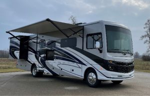 Image of Fleetwood RV on an end street by a field