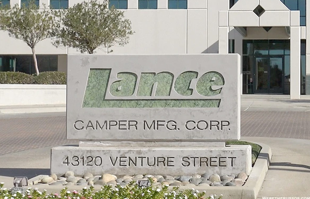 Image of the Lance Camper sign in front of the Lance Camper building