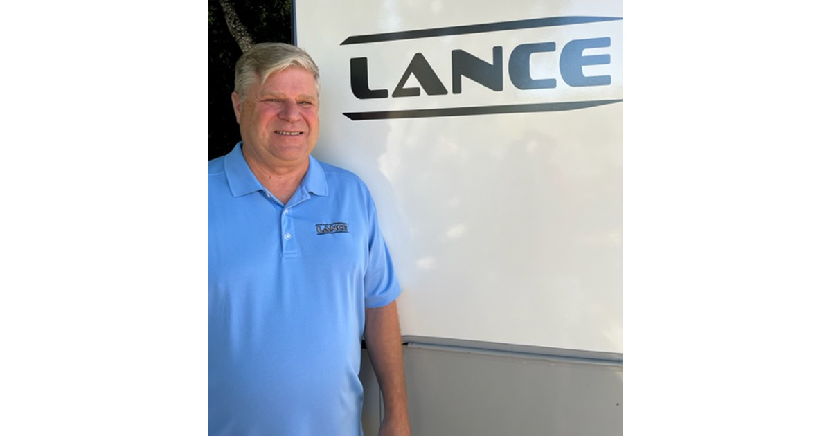 Image of Scott Almquist in front of a Lance Camper