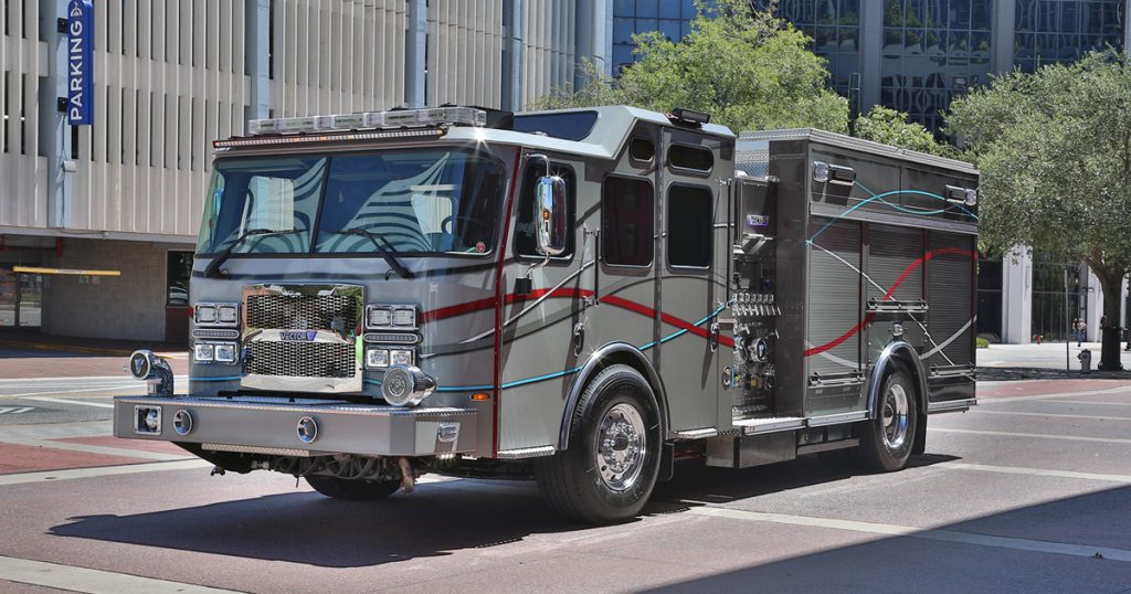 Image of the Vector Fully Electric Fire Truck on a street with buildings behind it